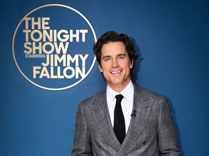 closeup of him against the tonight show logo wall