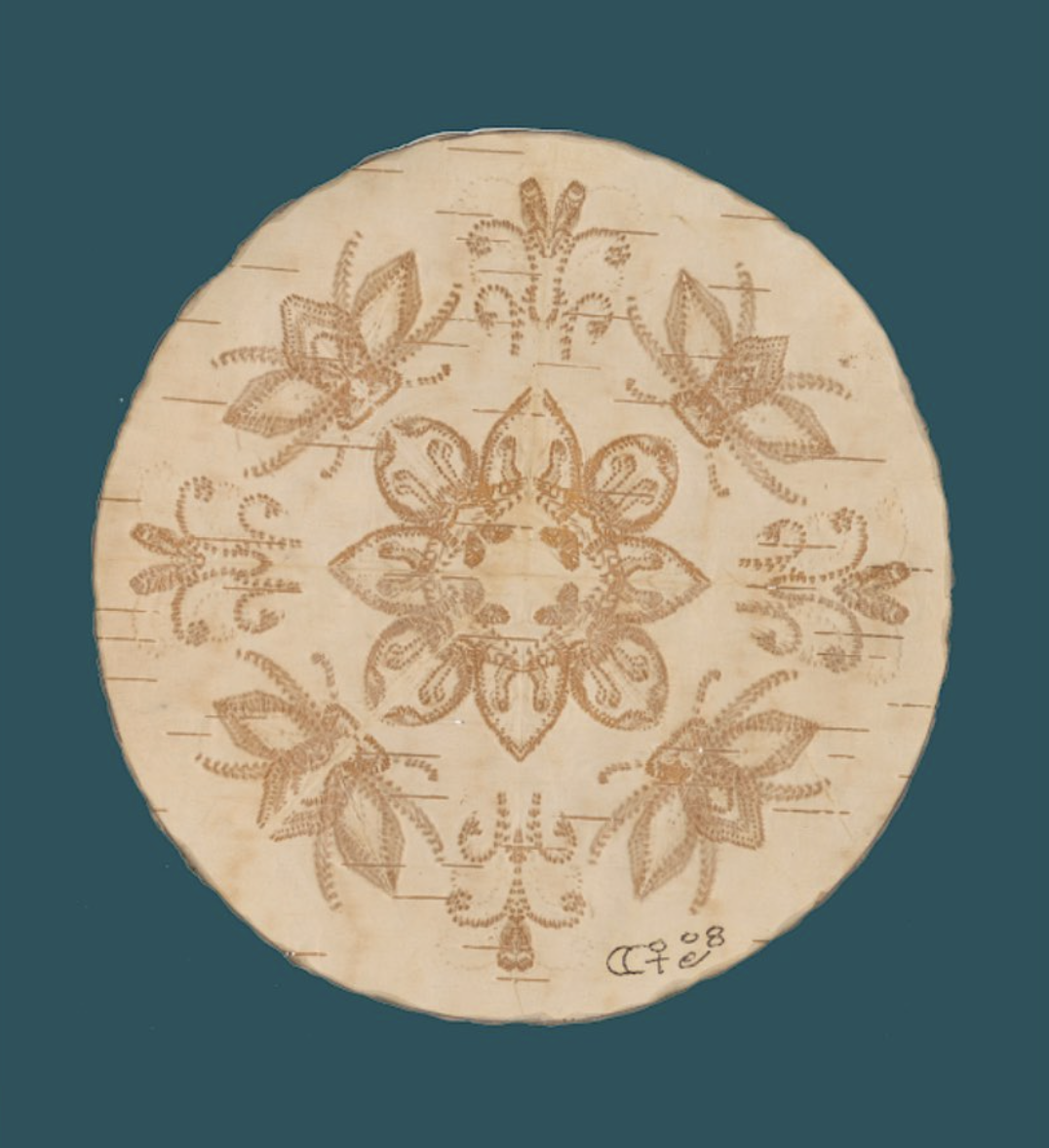 A handcrafted wooden piece of art in a circular form.