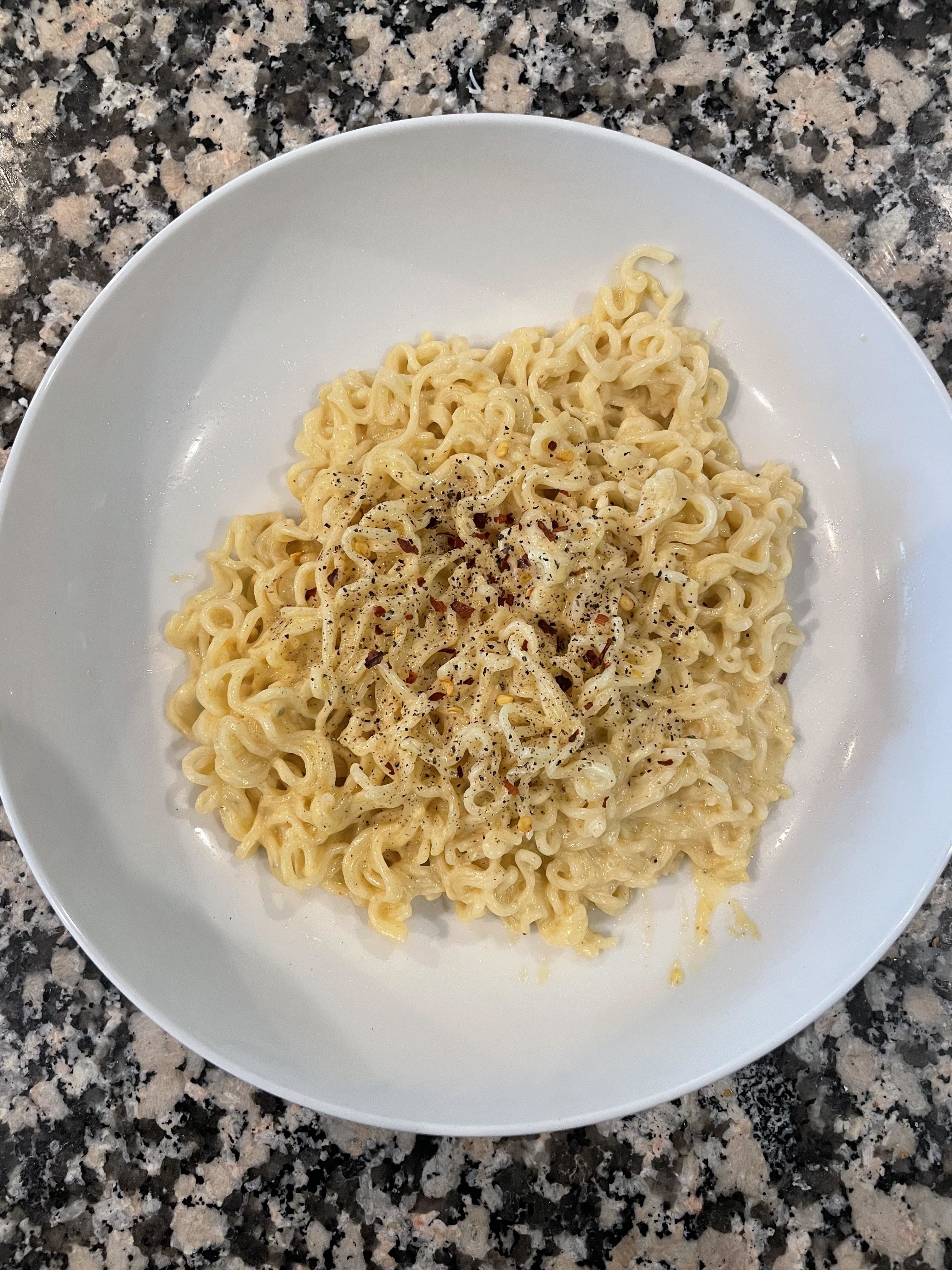ramen on a plate with pepper
