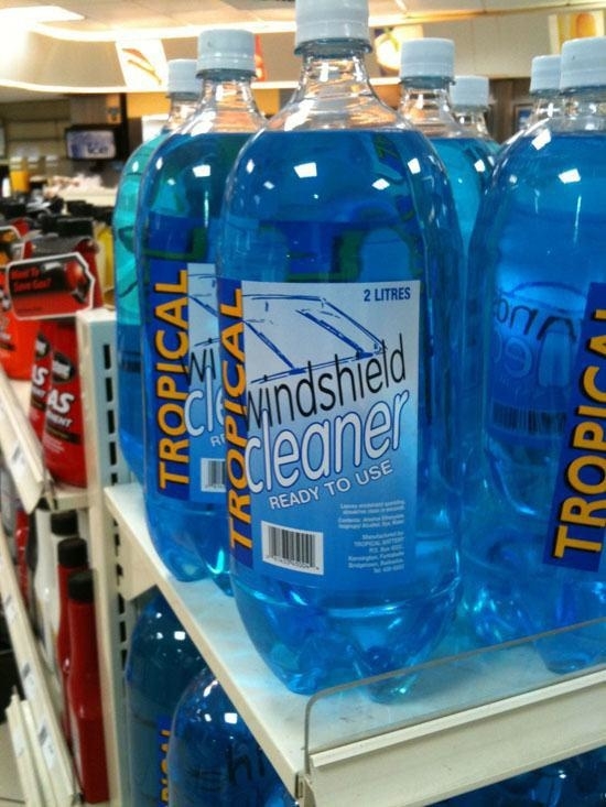 two liter bottles of blue windshield cleaner
