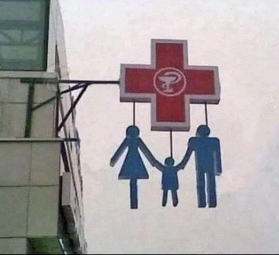 A sign that looks like a family hanging from a cross