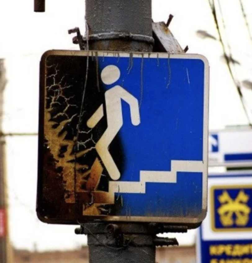A street sign of for walking down steps
