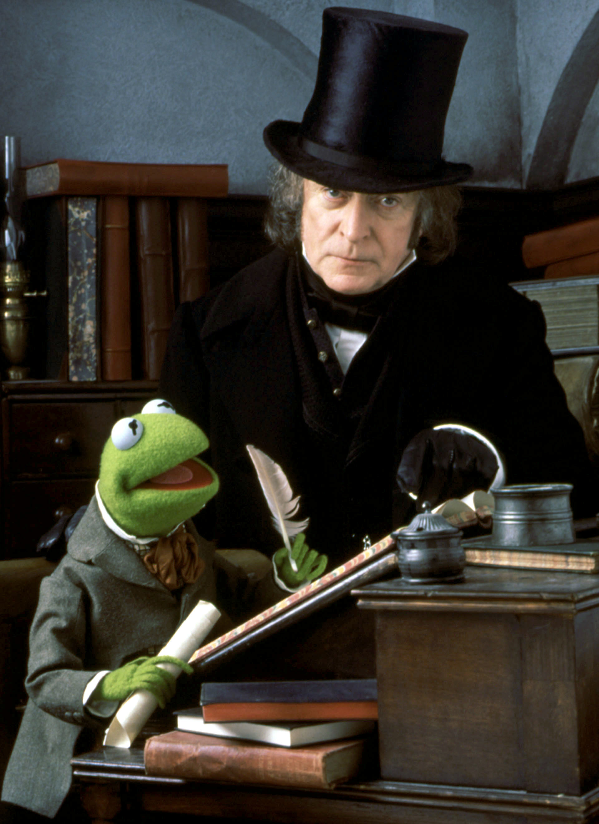 him and kermit at a desk