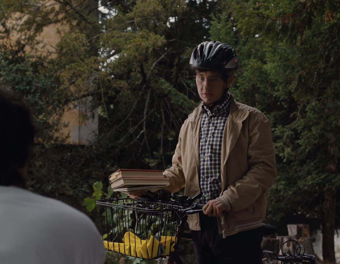 oliver on a bike carrying books