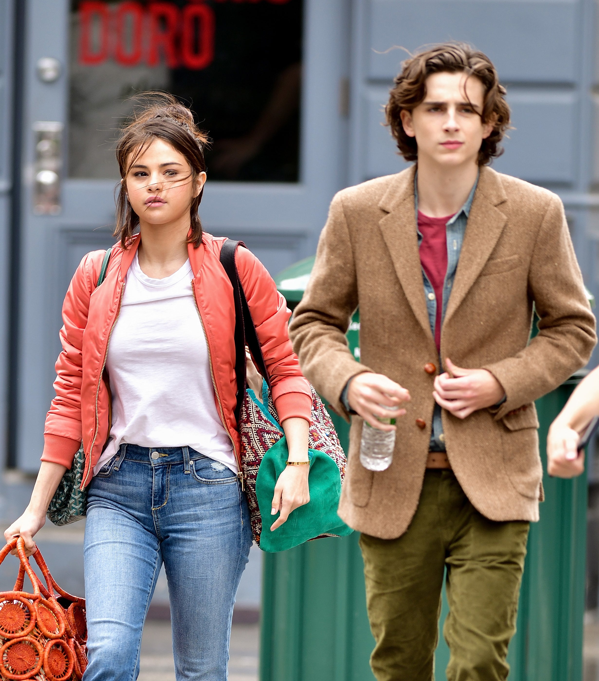 selena and timmy walking outside in their film