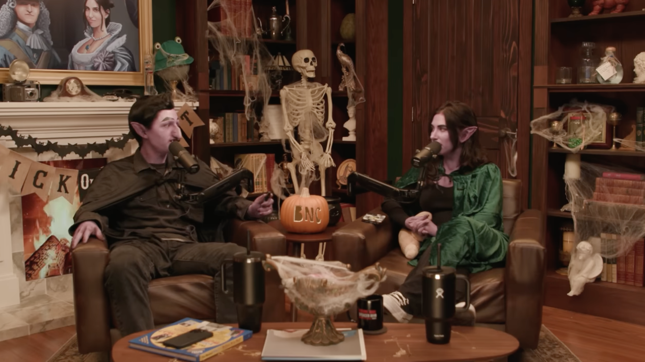 the two doing a podcast dressed up for halloween