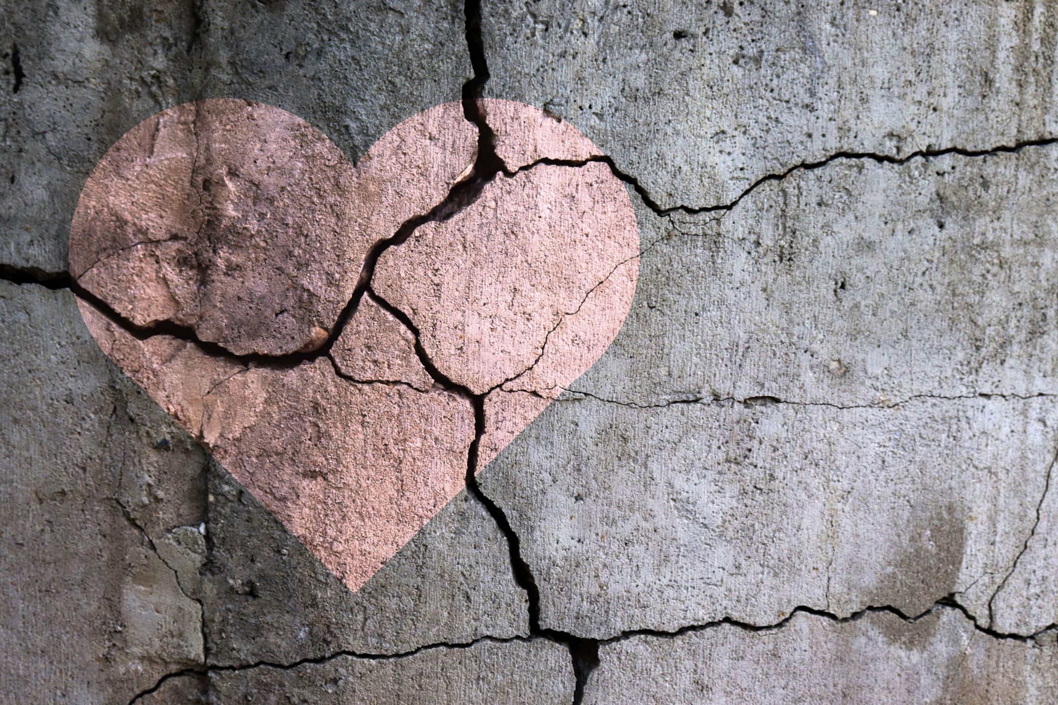 A heart painted on a cracked wall