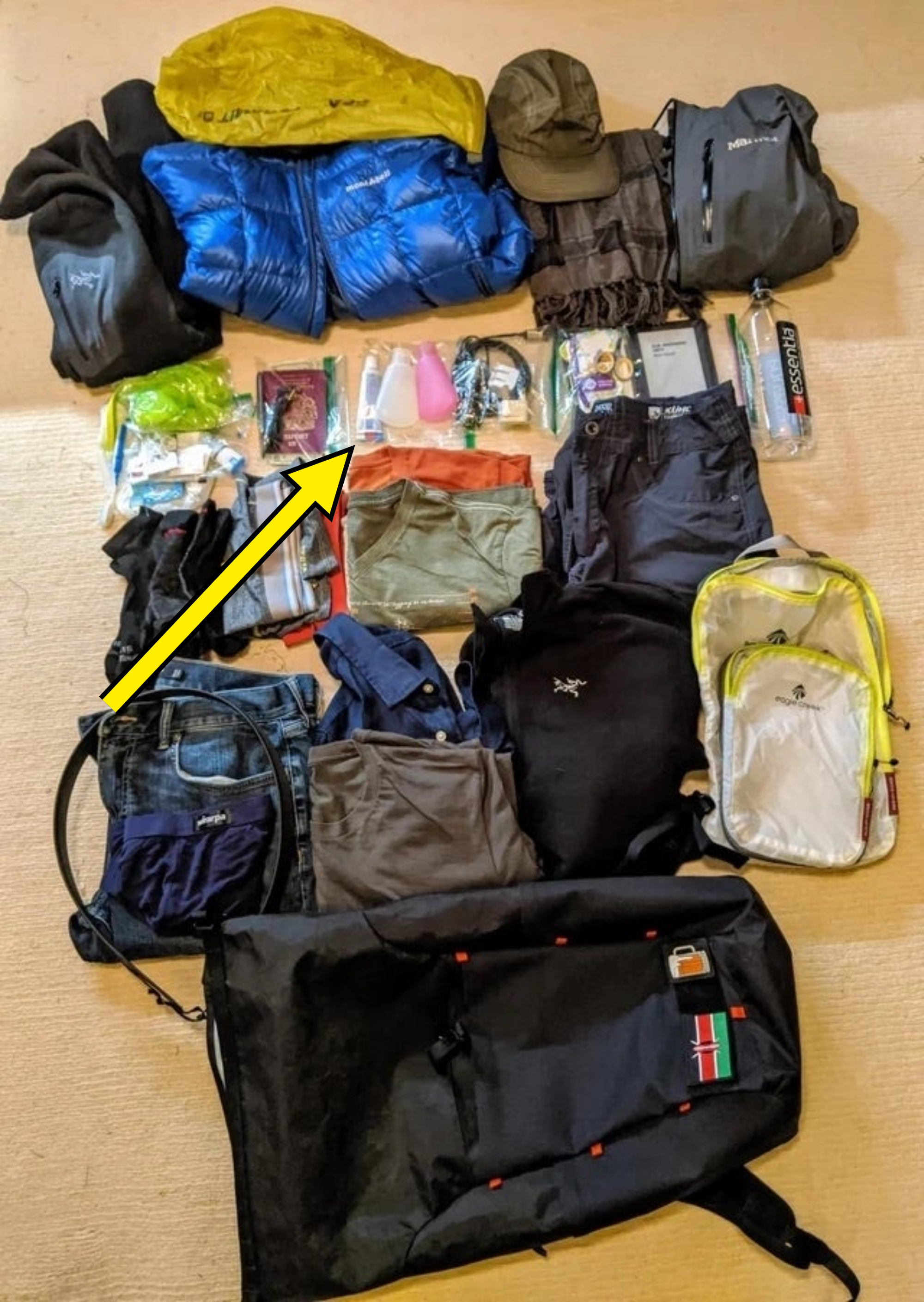 Clothing and other travel items laid flat