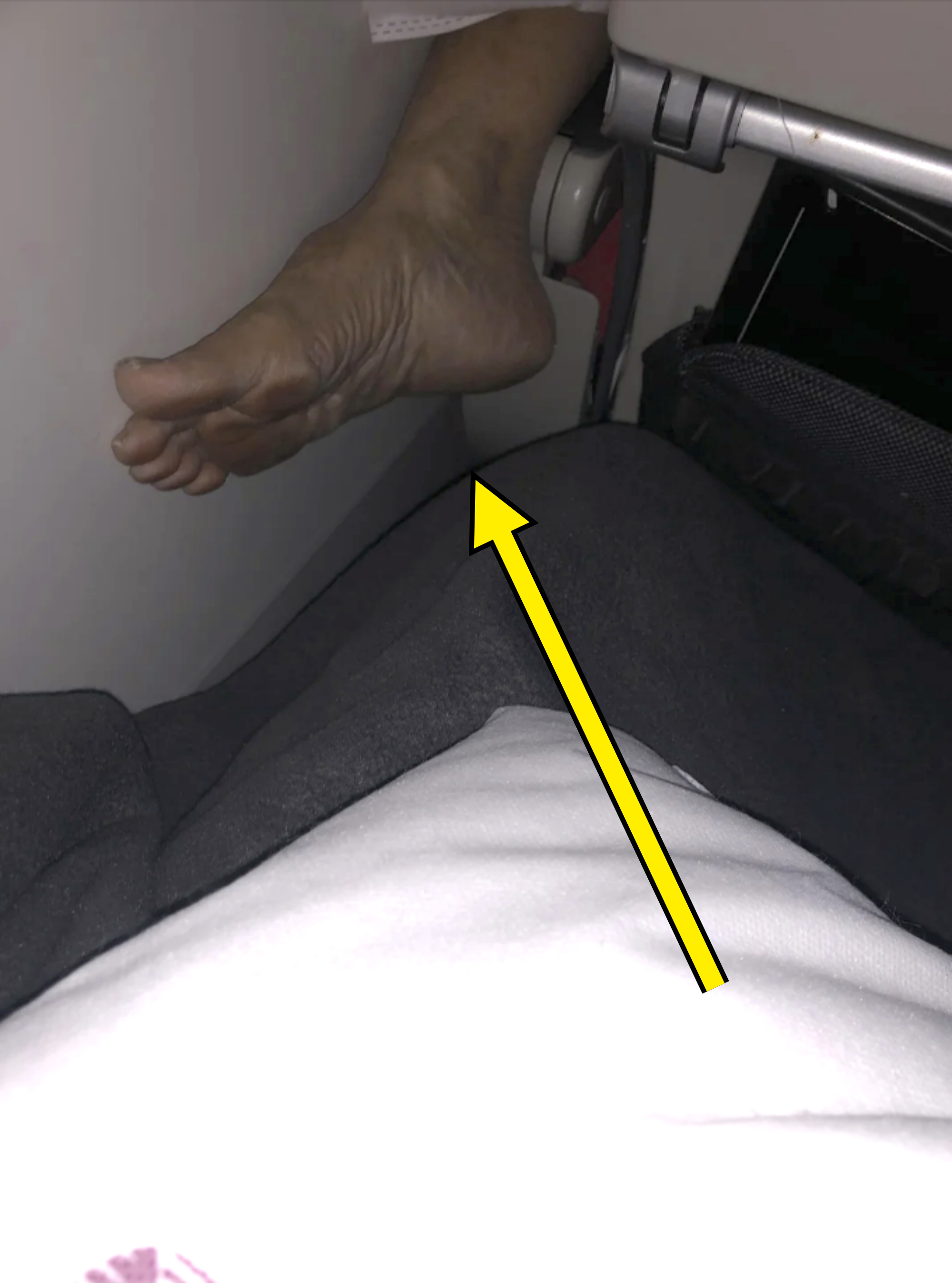 person&#x27;s dirty bare foot in someone&#x27;s space