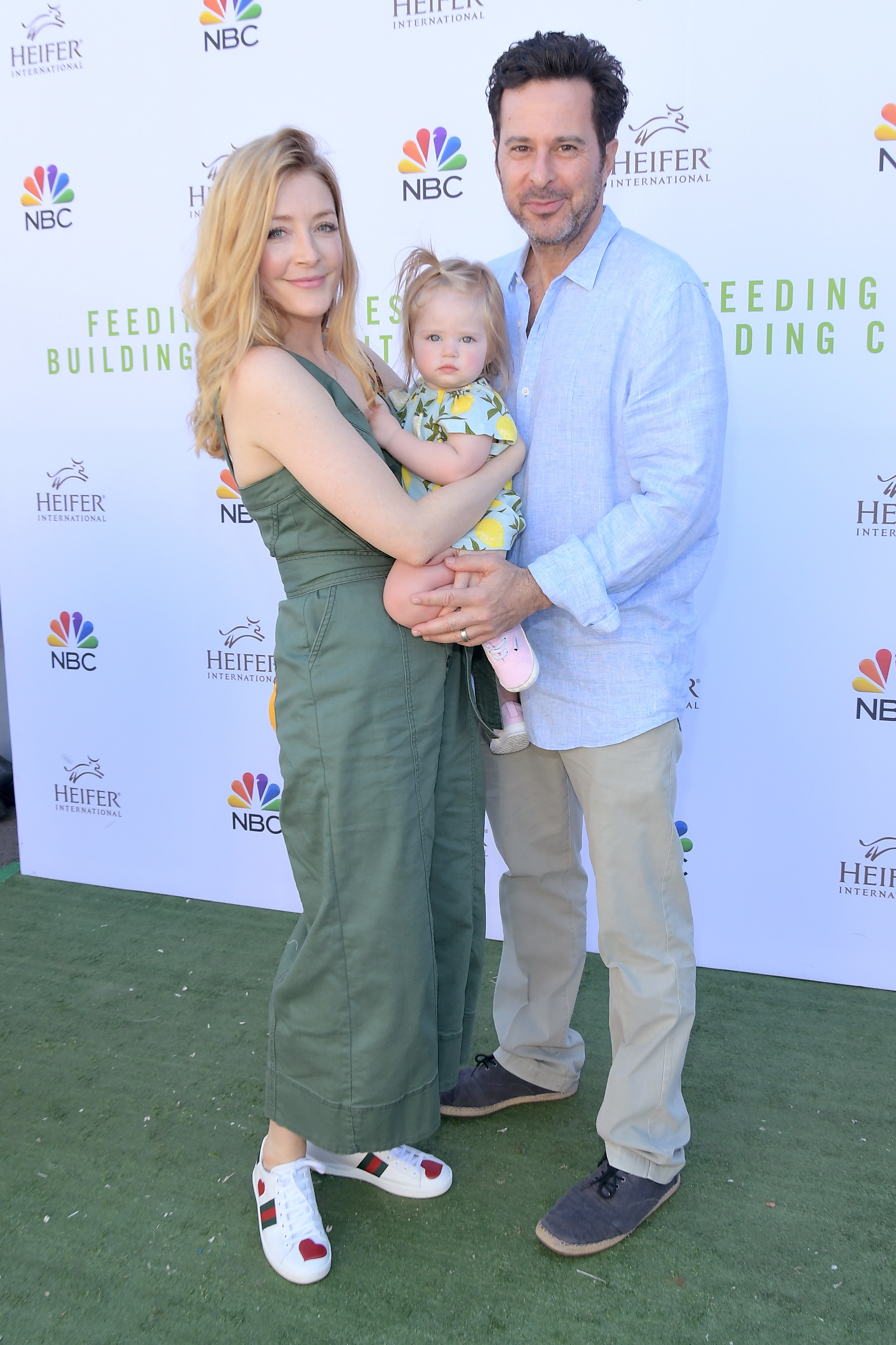 they&#x27;re dressed casually with their baby at an NBC event