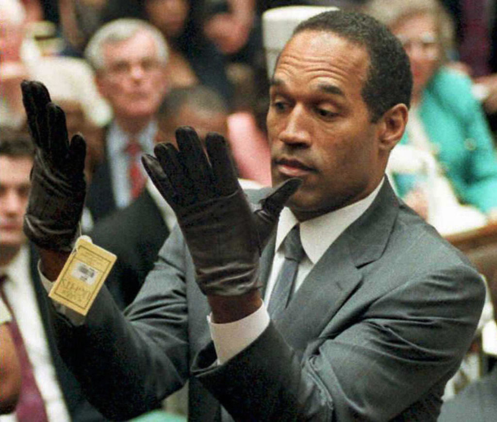 simpson in court trying on gloves