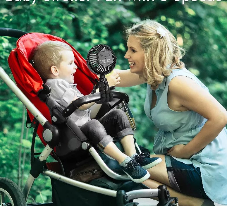 Black fan attached to stroller