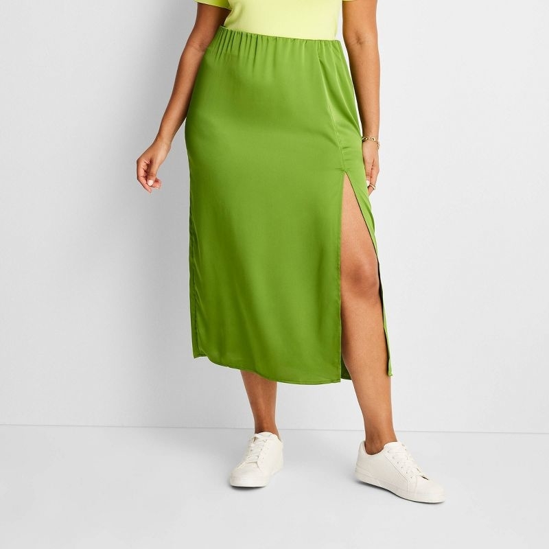 Model wearing the green slip skirt
