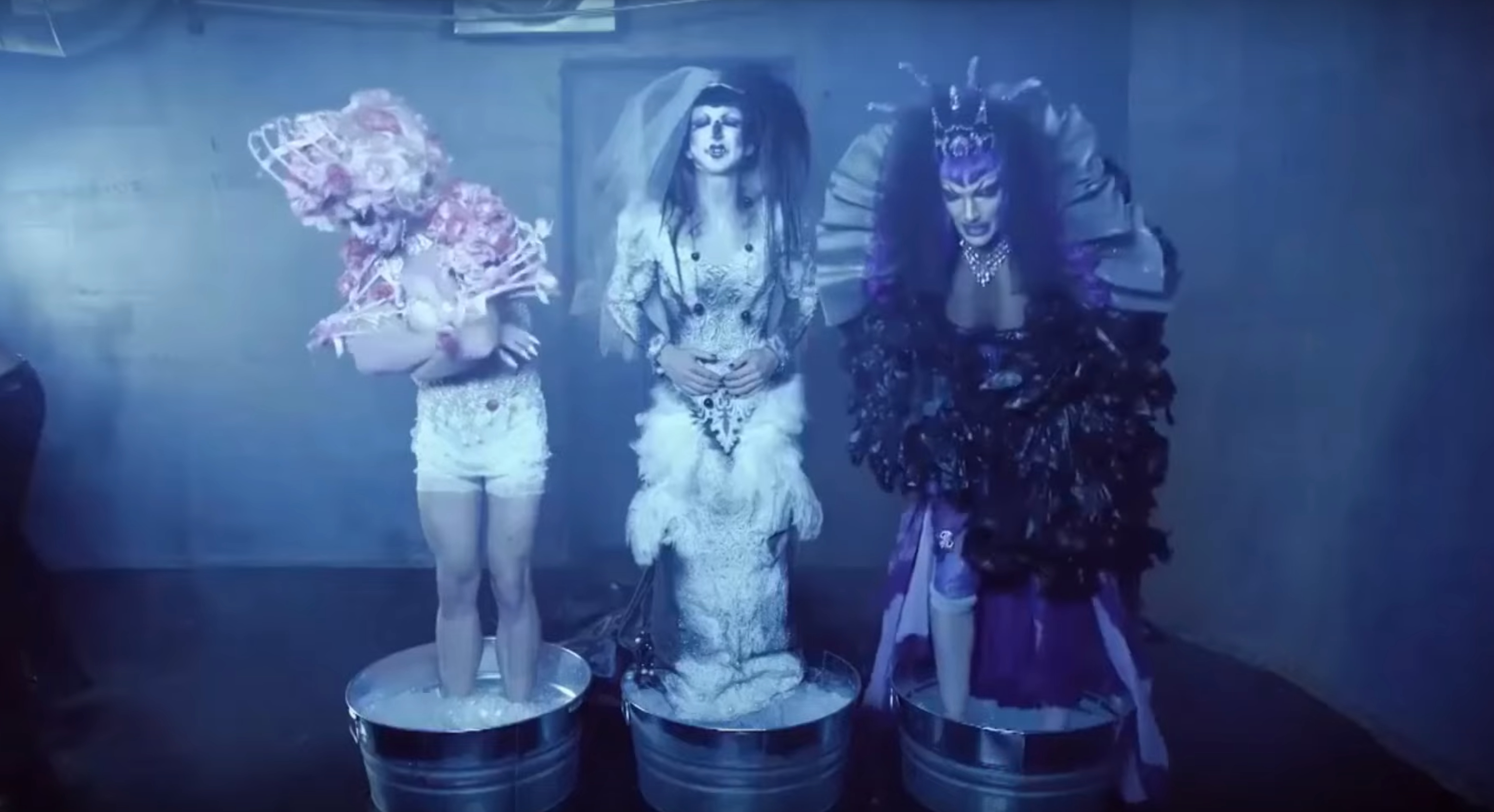 James Majesty, Abhora, and Disasterina standing in buckets of ice.