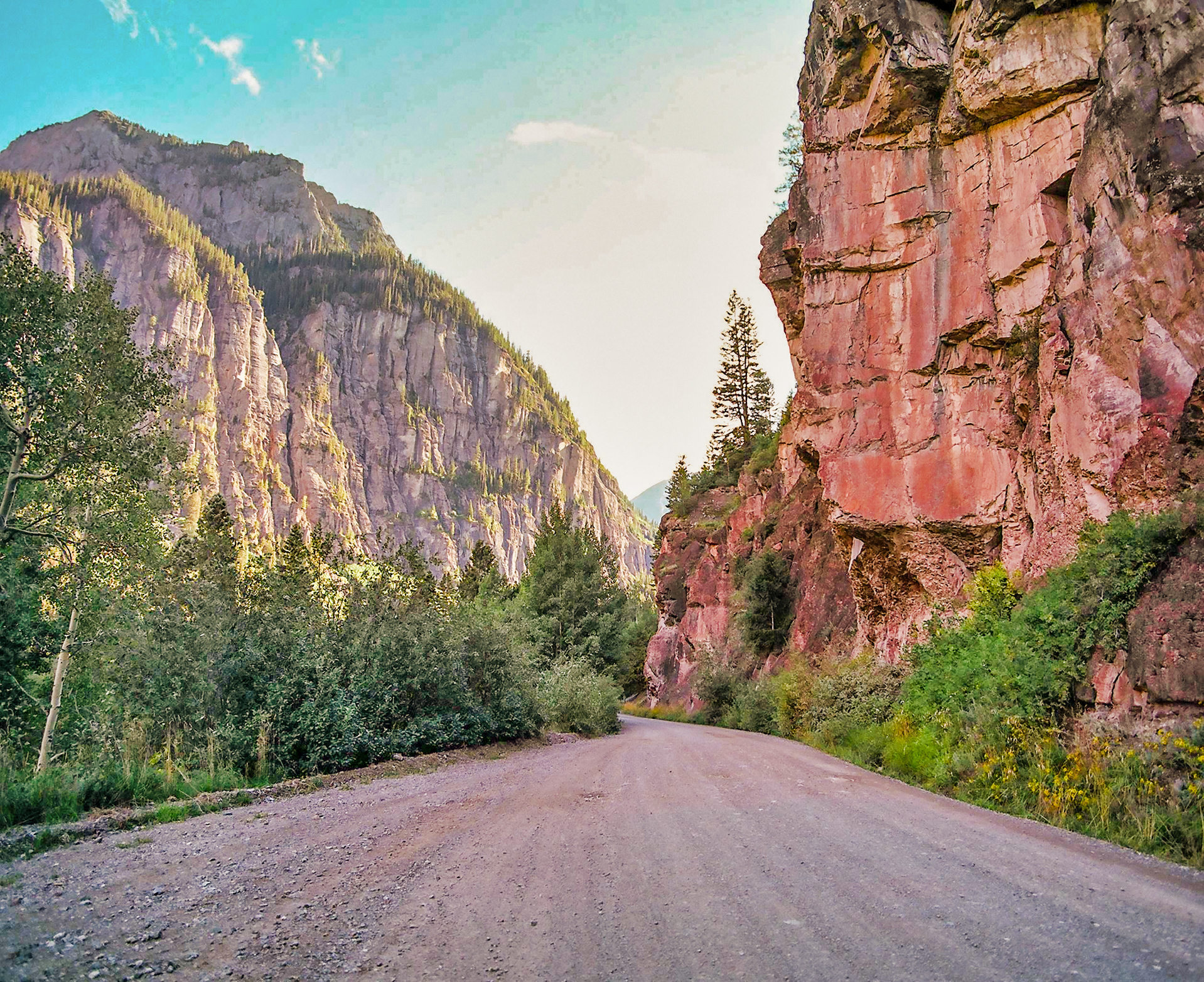 A road that runs through the rocky hills of San Juan Mountains at Ouray, Colorado