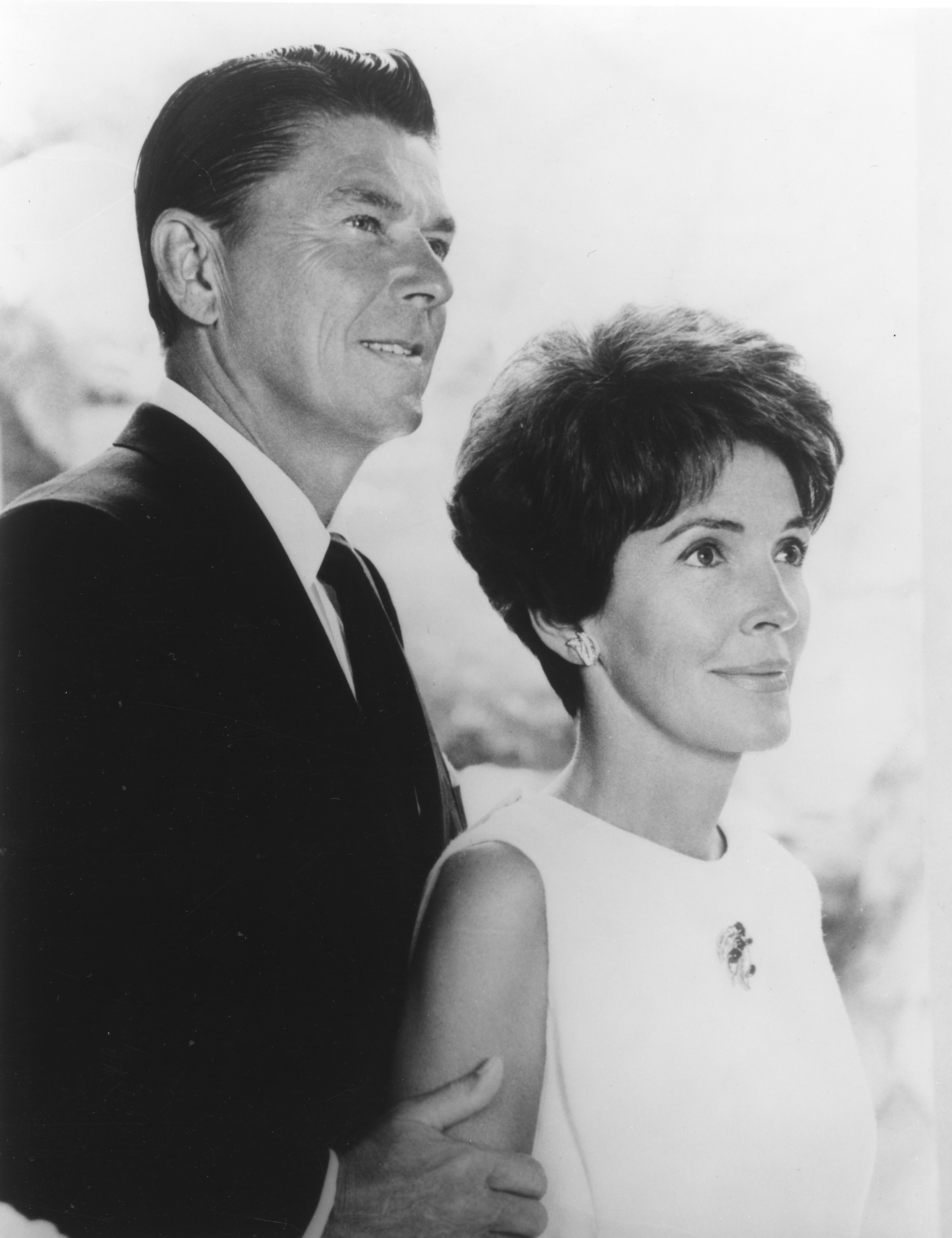 Close-up of Ronald in a suit and tie with Nancy Reagan