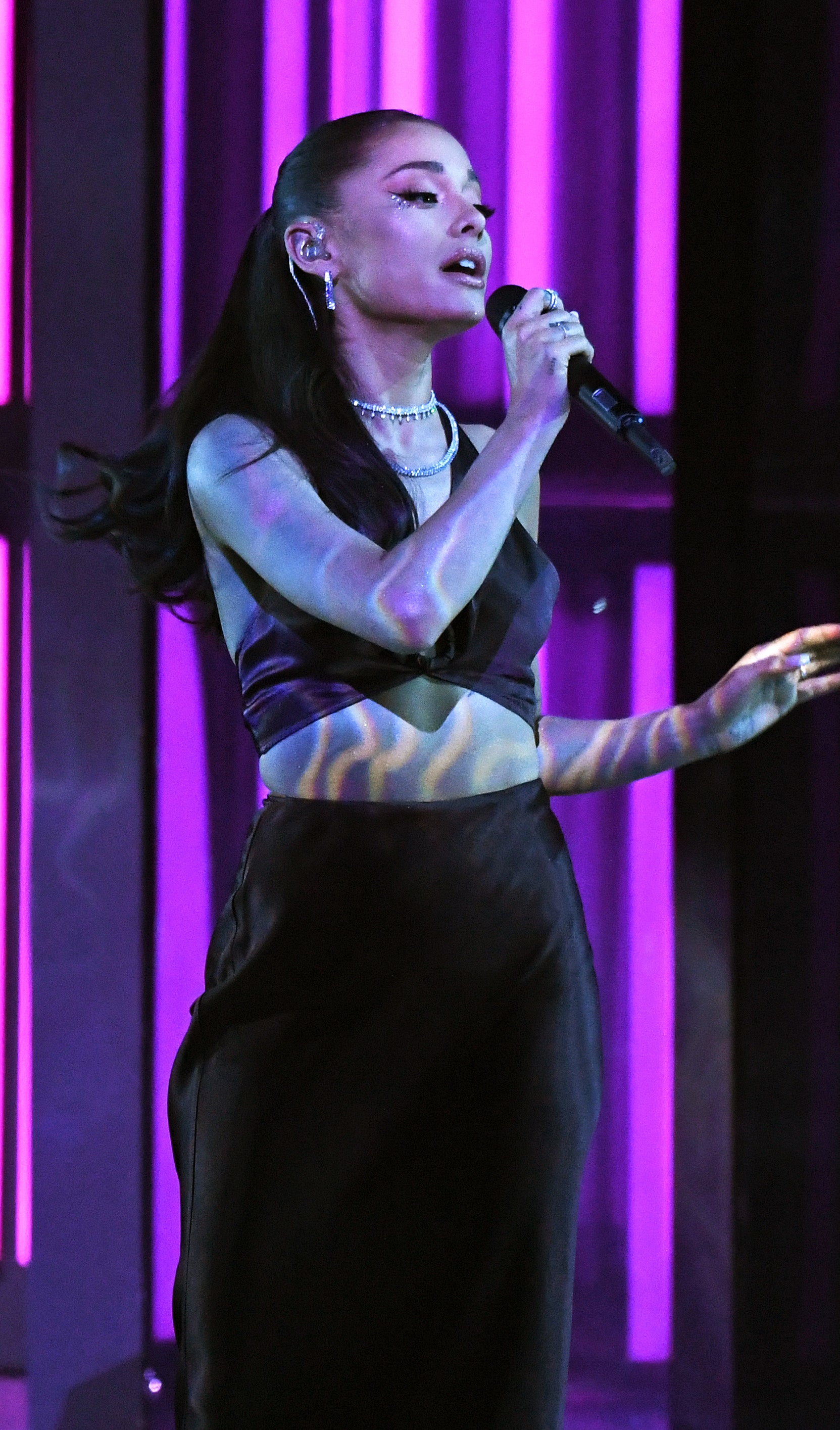 Close-up of Adriana performing onstage