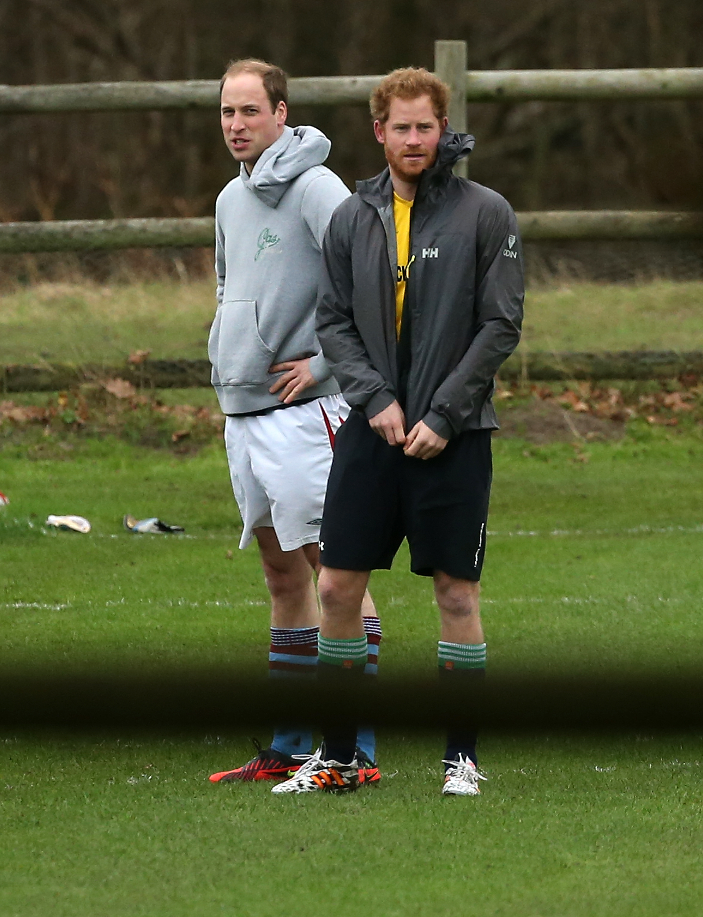 Close-up of Willy and Harold in shorts and hoodies on the grass