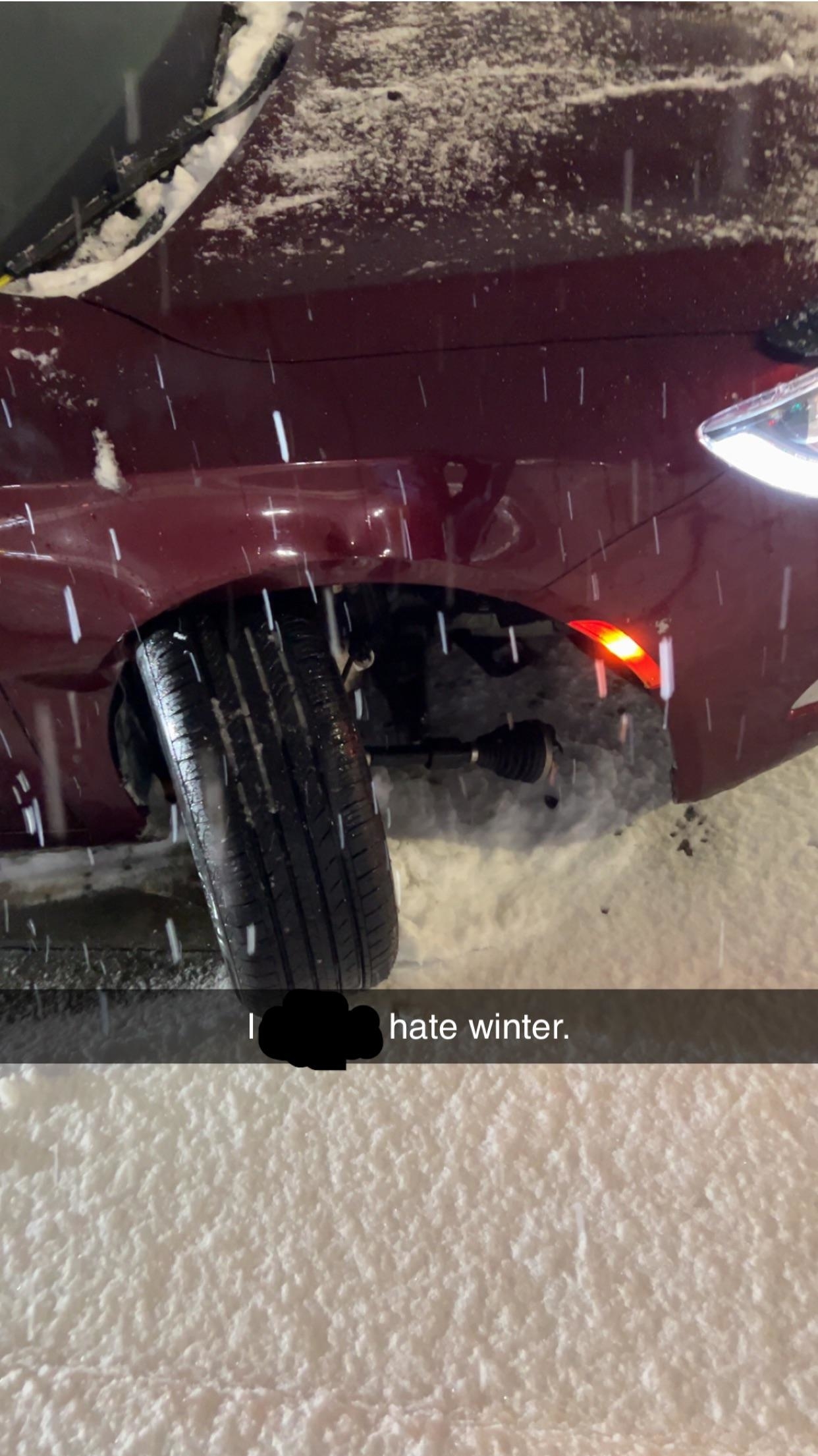 &quot;I hate winter&quot; showing a car in the snow with a wheel at a very strange angle