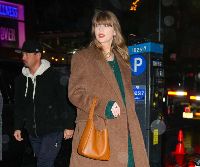 Close-up of Taylor wearing a coat outside