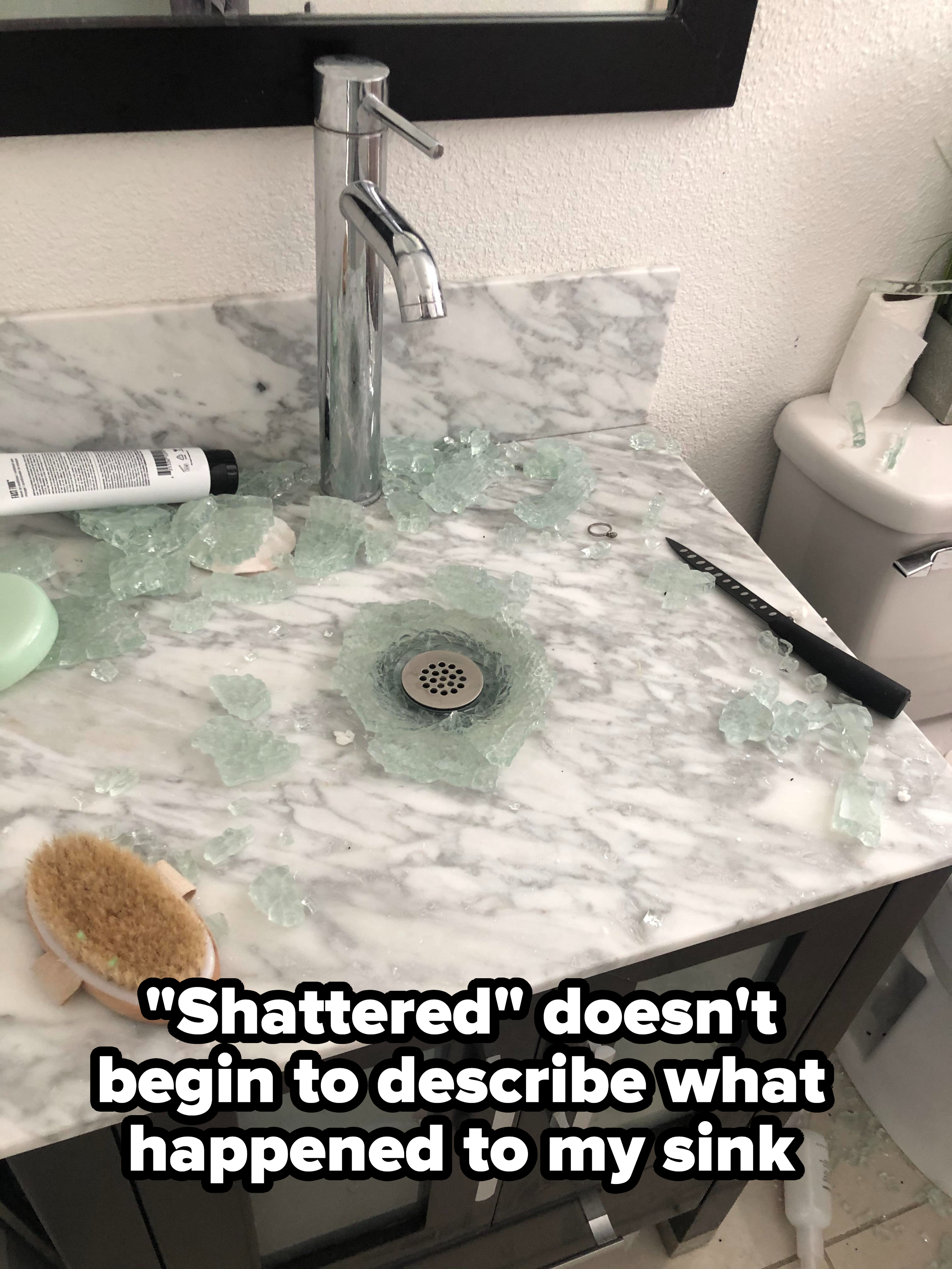 A sink with shattered glass all over it: &quot;&#x27;Shattered&#x27; doesn&#x27;t begin to describe what happened to my sink&quot;