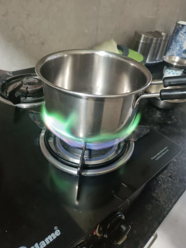 the flames under the pot are green