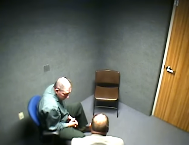 him in an interrogation room