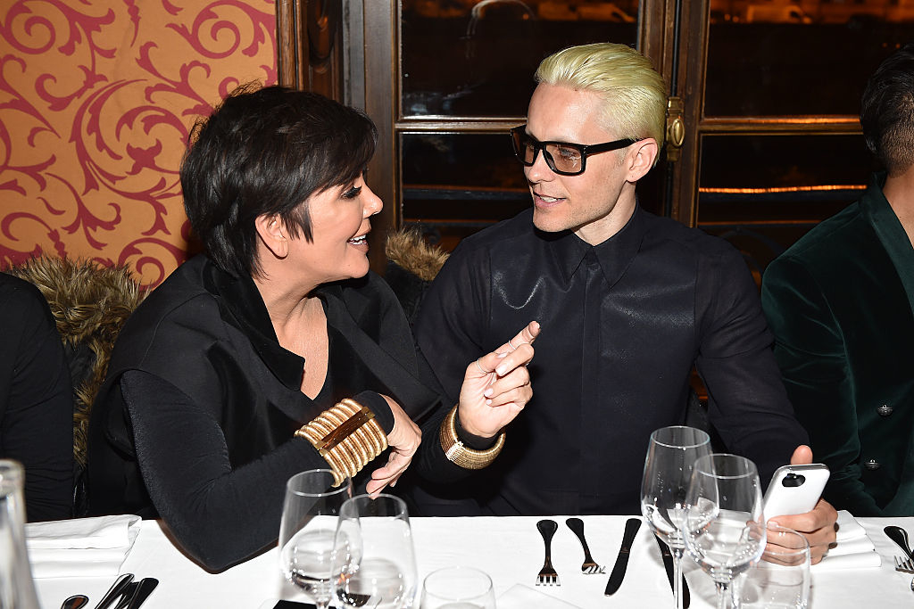jared and kris jenner talking at a dinner table
