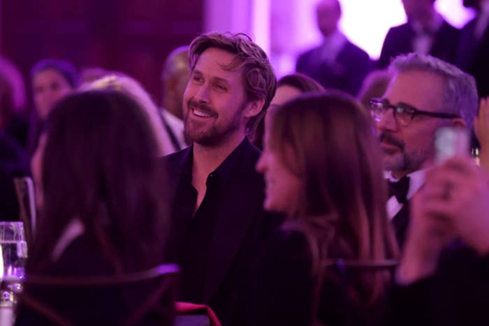 Closeup of Ryan Gosling sitting next to Steve Carrell