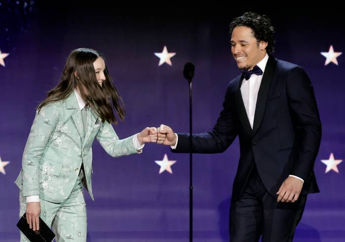 Bella Ramsey and Anthony Ramos fistbumping onstage