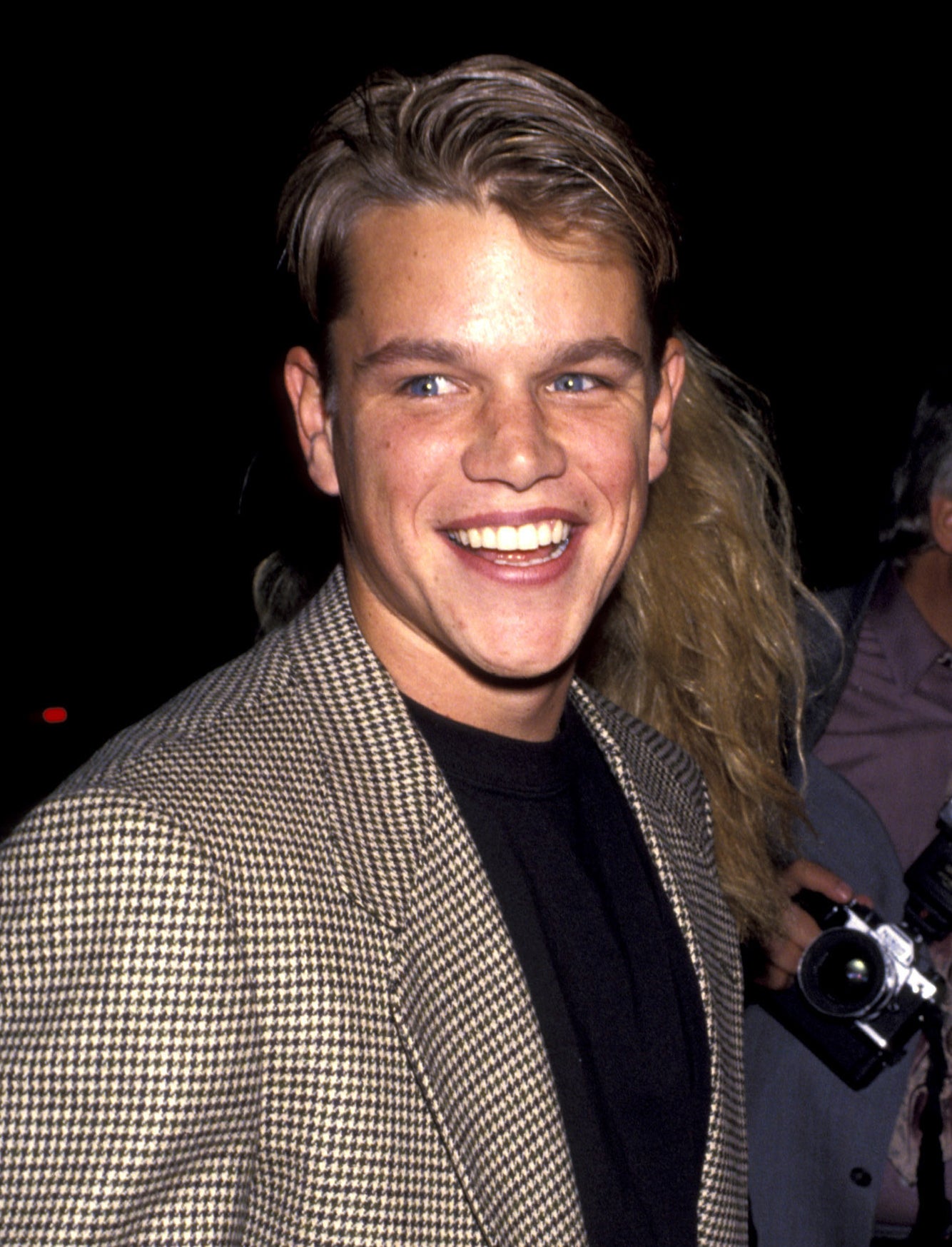 Closeup of Matt Damon smiling widely