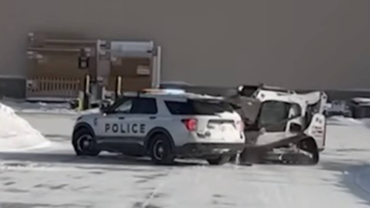 The Bobcat-driving man even hit a police SUV with an officer behind the wheel.