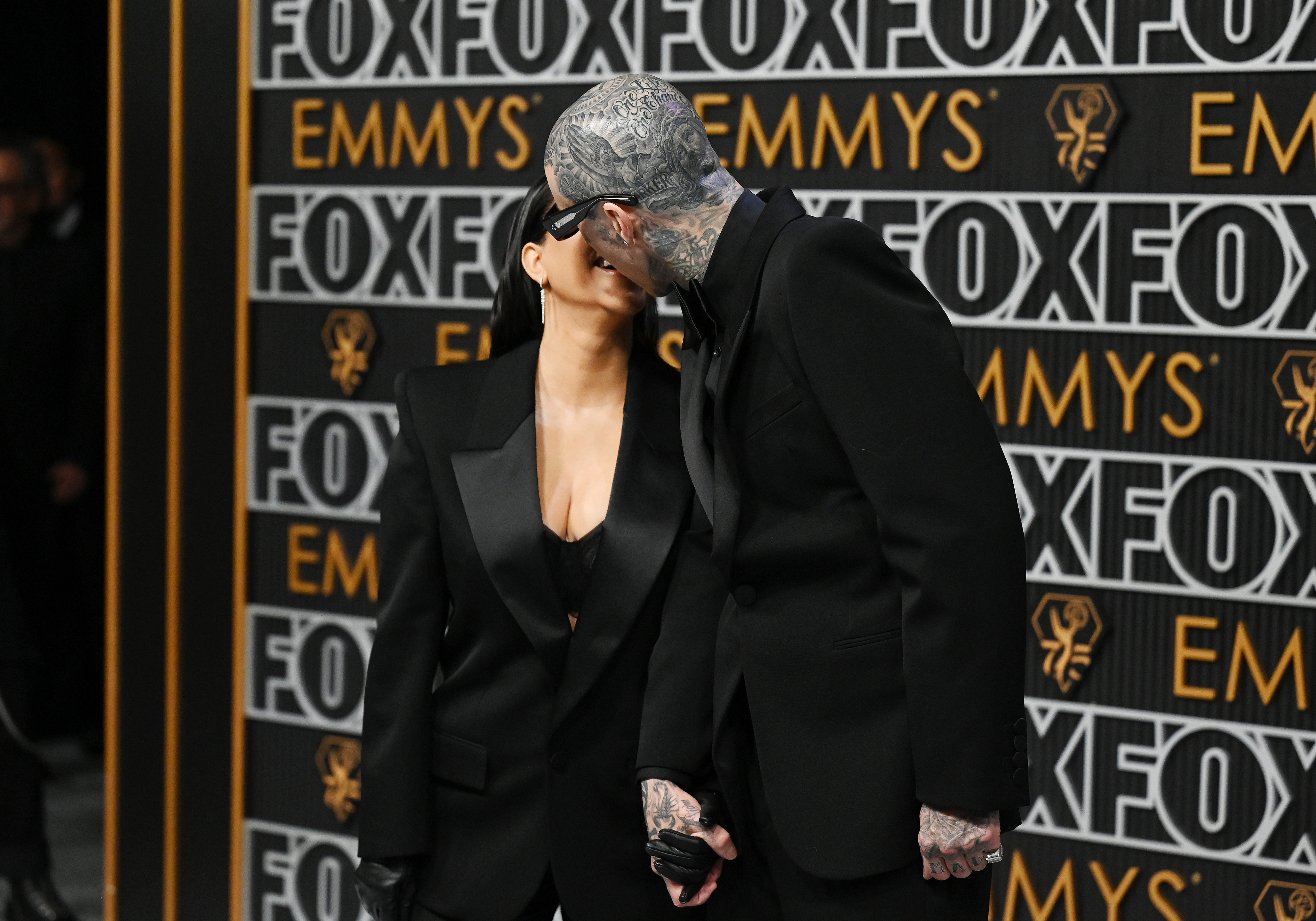 Closeup of Kourtney Kardashian and Travis Barker kissing