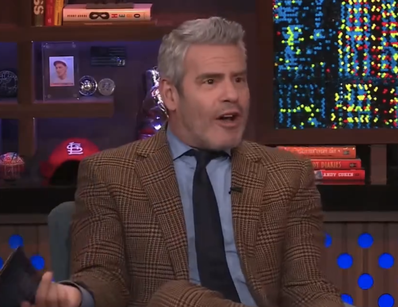A closeup of a shocked Andy Cohen