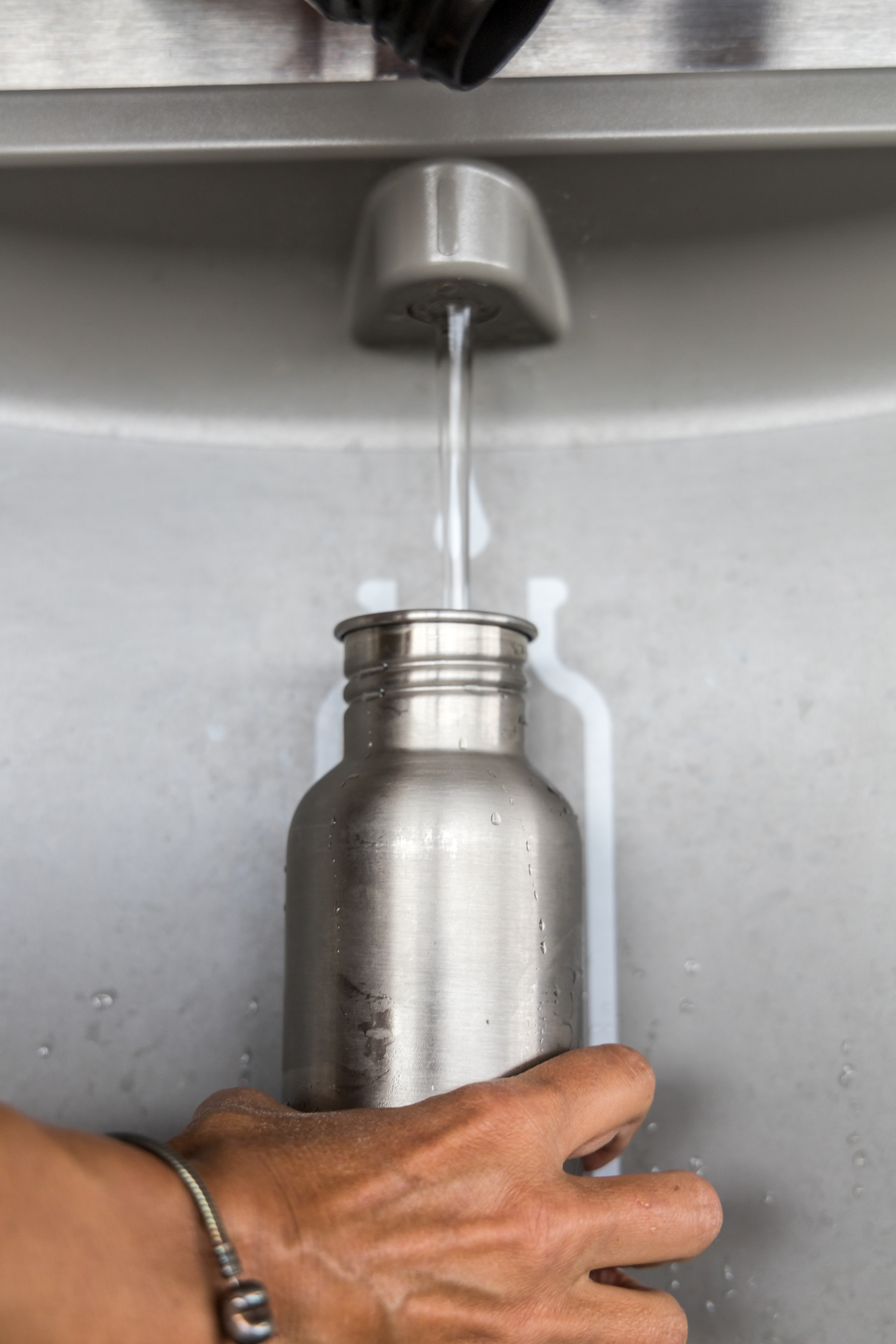 refilling a portable stainless steel water bottle