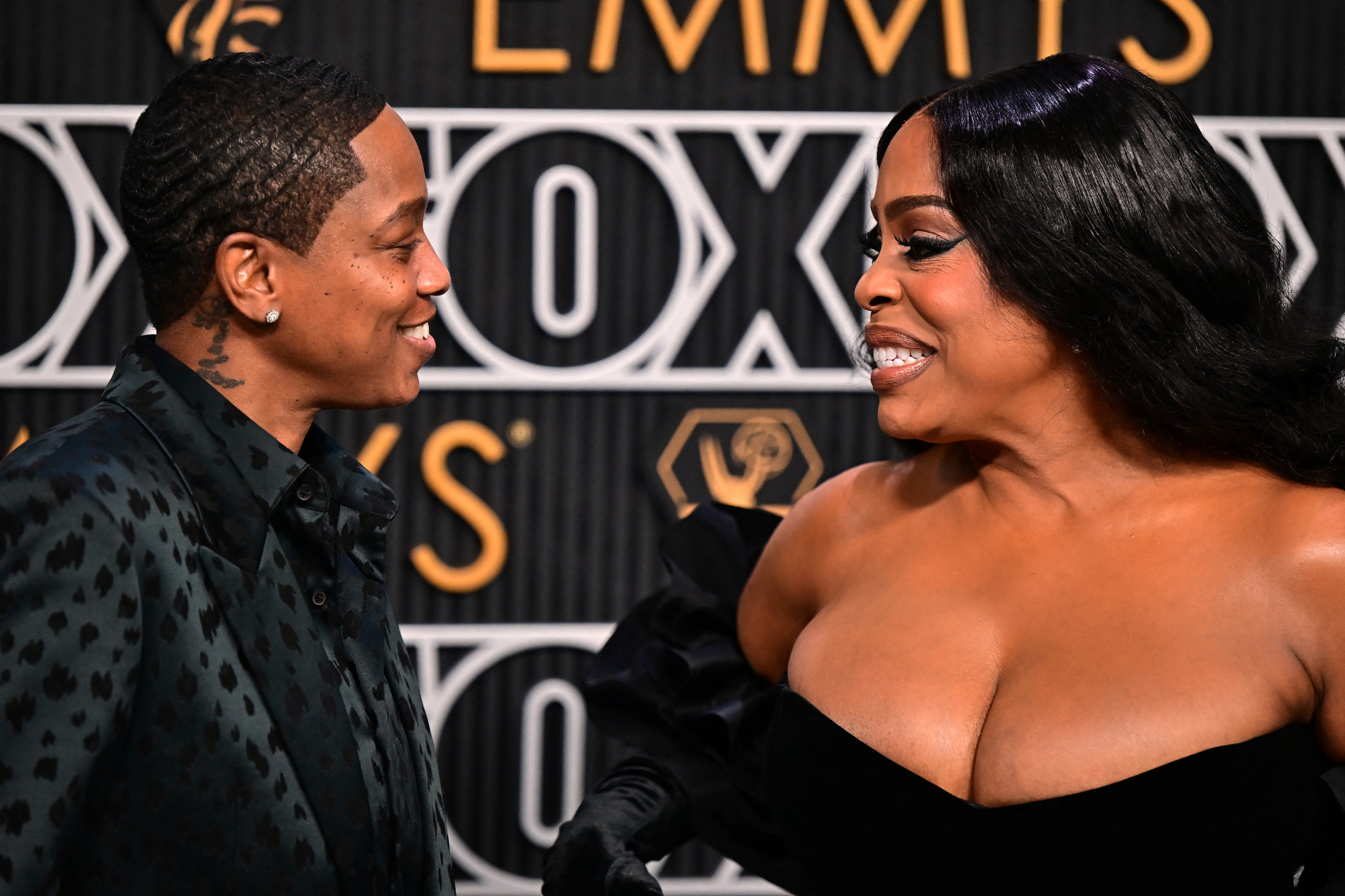 Jessica Betts and Niecy Nash-Betts looking at one another