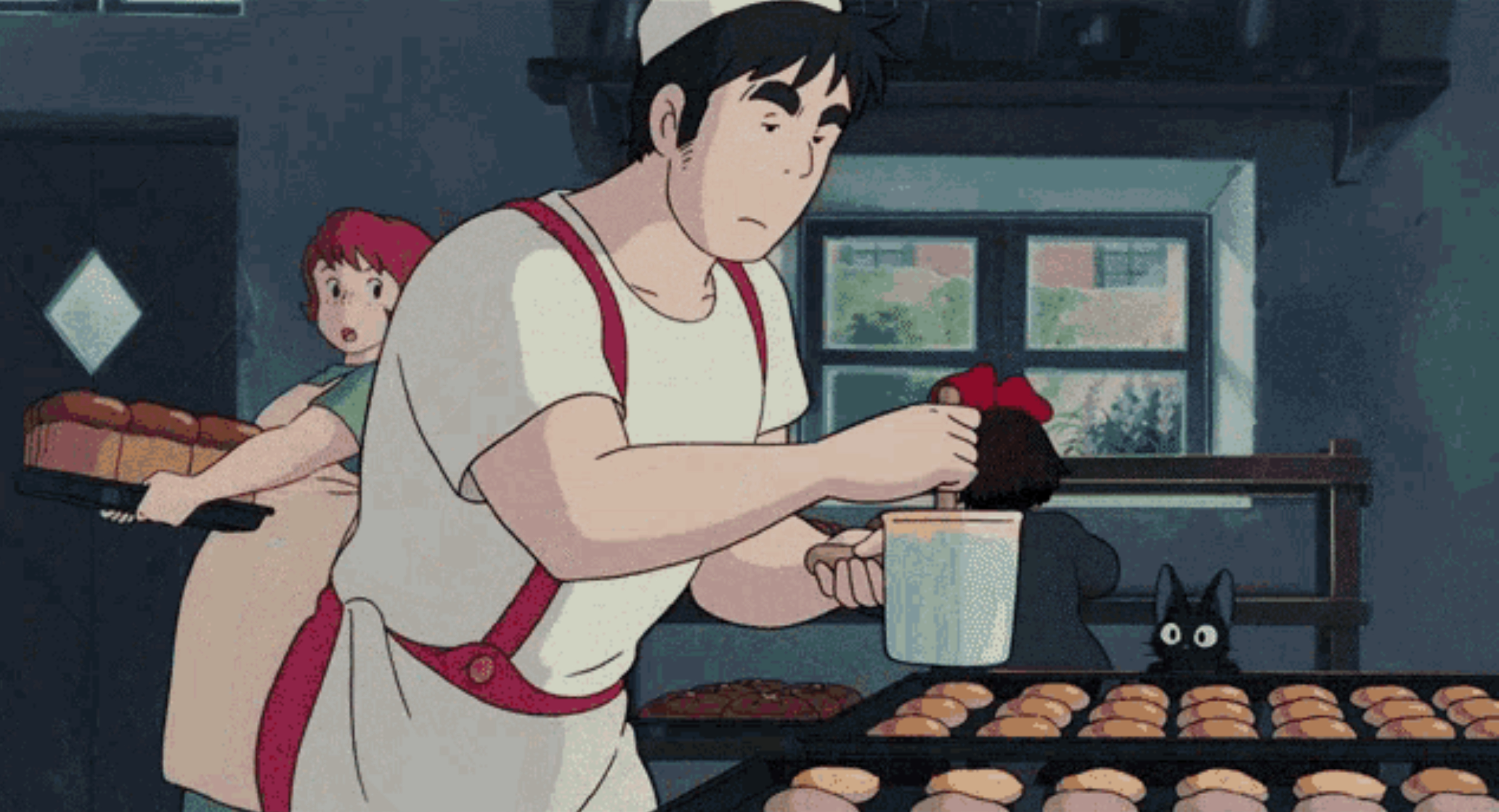 A man in an apron cooking.