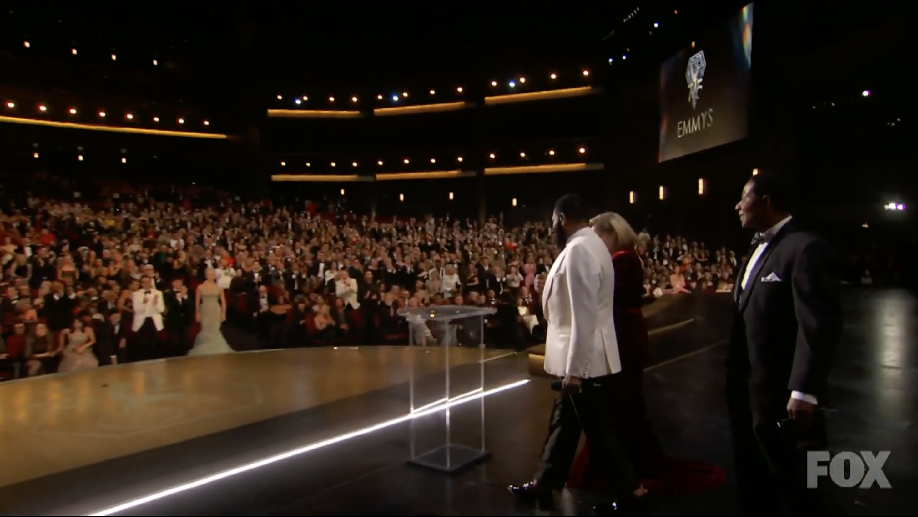 Anthony Anderson escorting Christina Applegate onstage at the 2024 Emmys