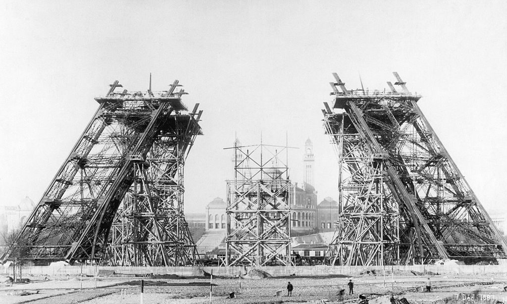 Black-and-white image of scaffolding at the base of the tower