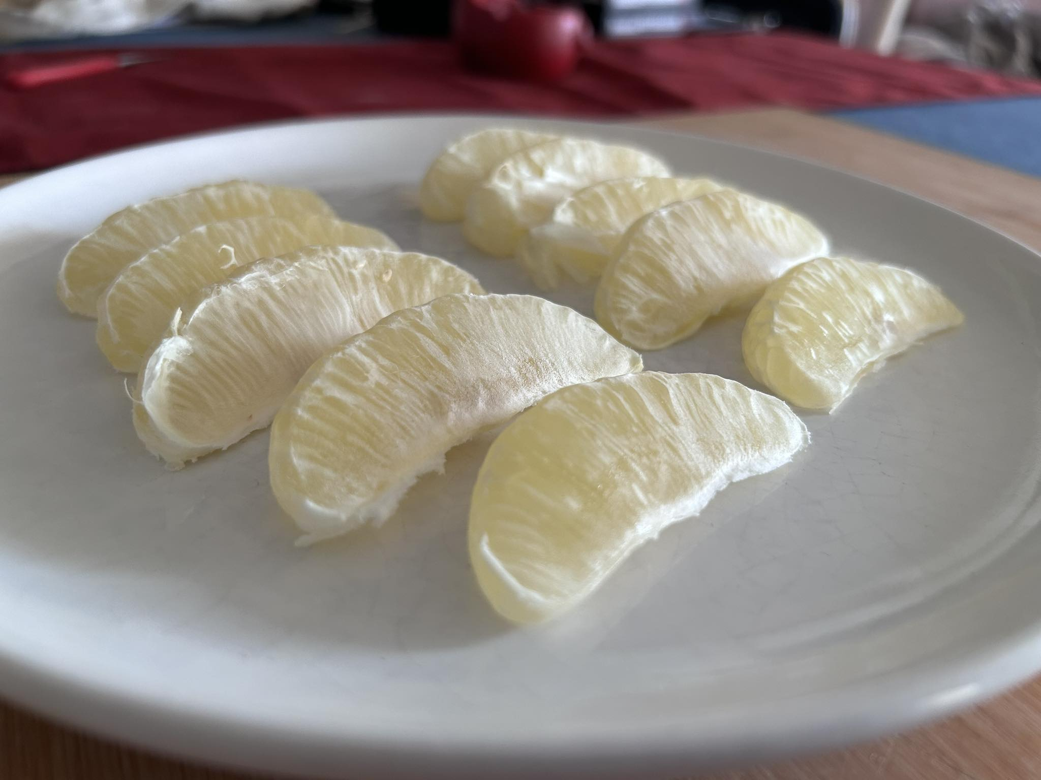 Very pale slices of fruit on a plate