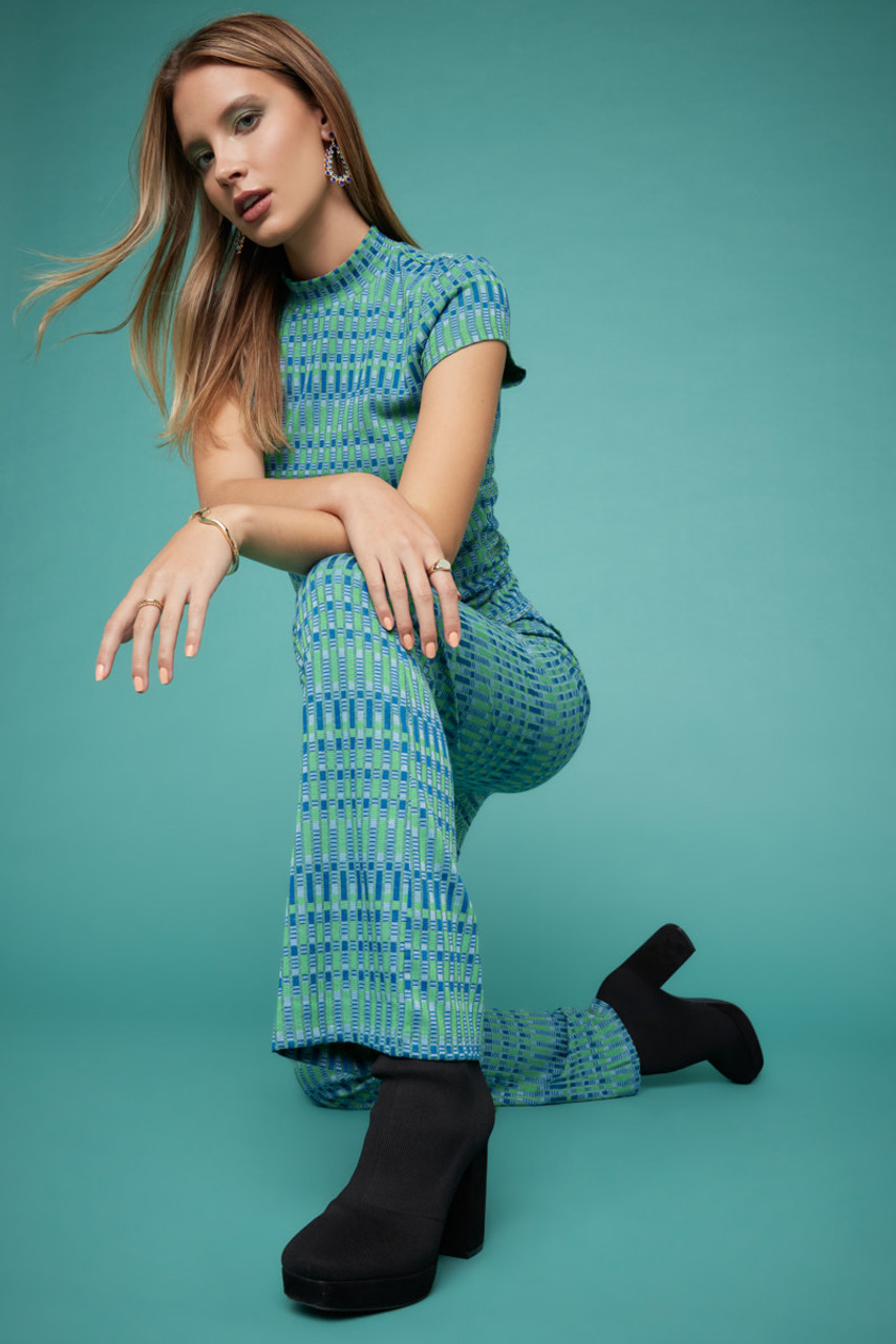 model in mint and blue graphic print set of short sleeve mock neck top and flare pants