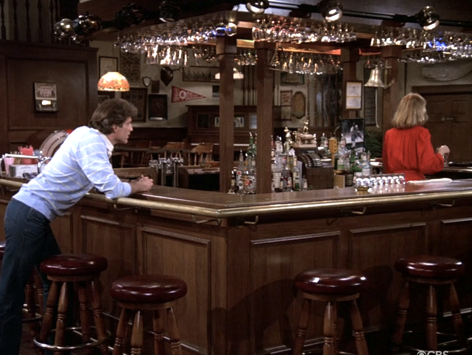a bar in the middle with Ted Danson leaning on it