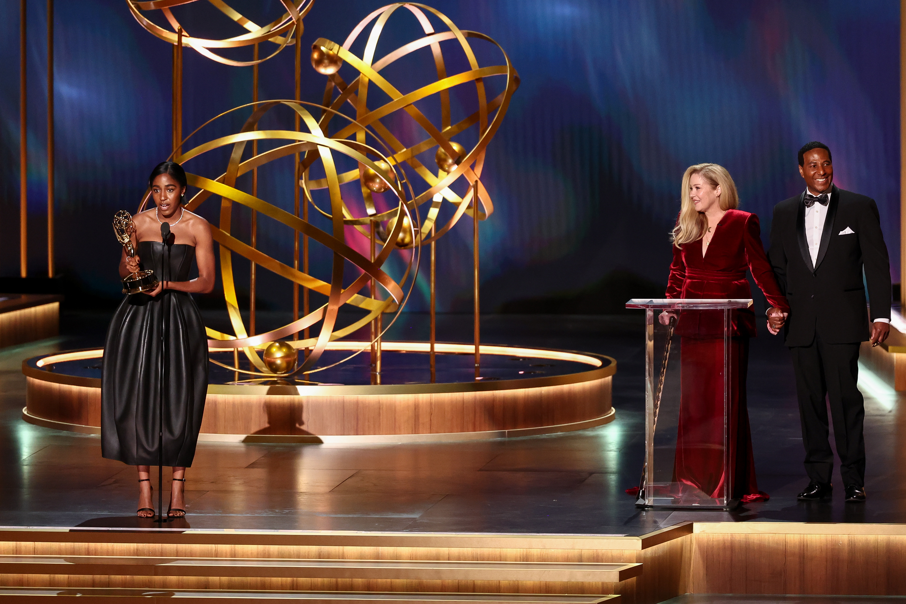 Ayo Edebiri accepting her Emmy award