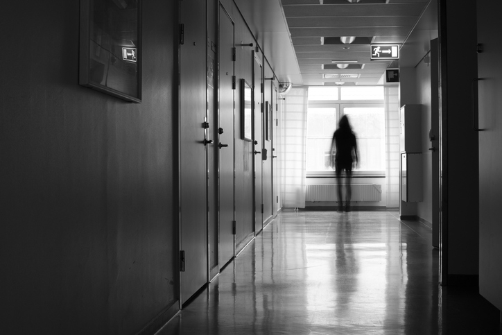 A dark silhouette in a hospital hallway