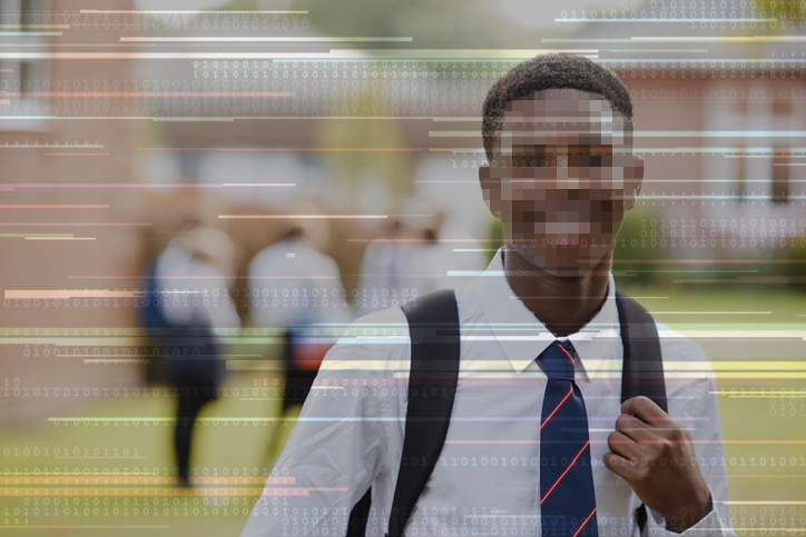 A young student with his face blurred