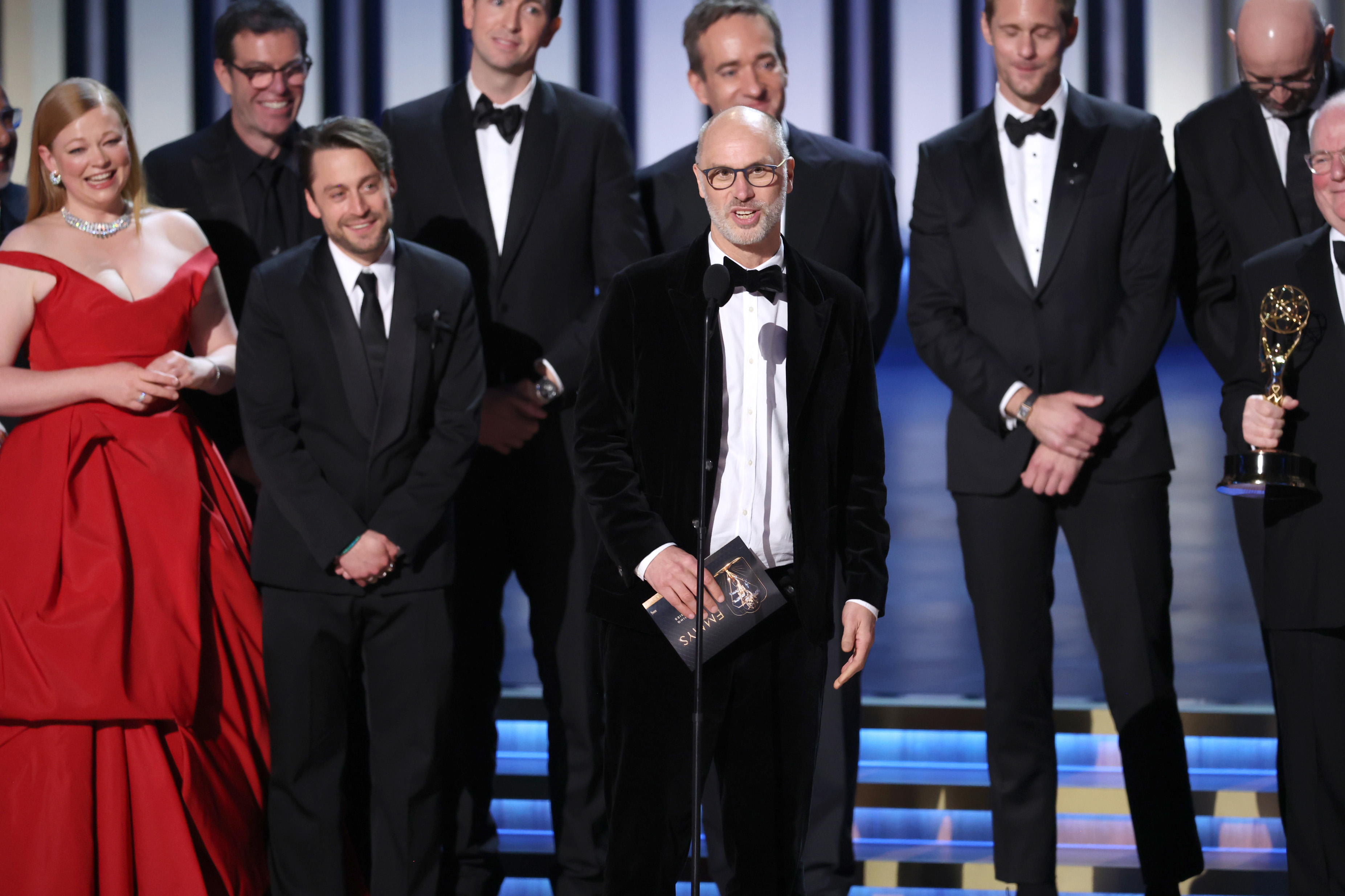 Jesse Armstrong and the cast and crew accepting an Emmy