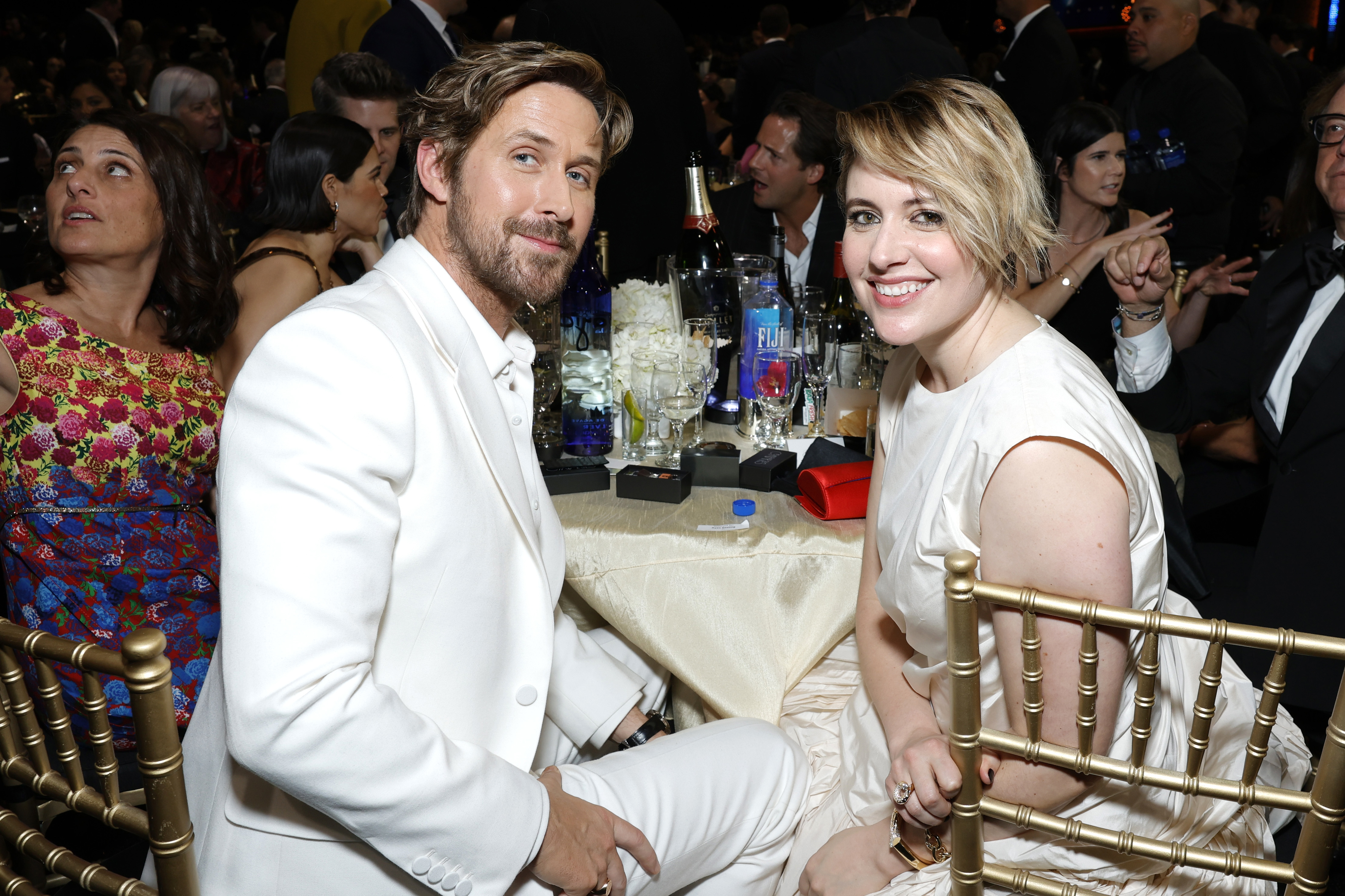 ryan and greta sitting at a table for an awards show