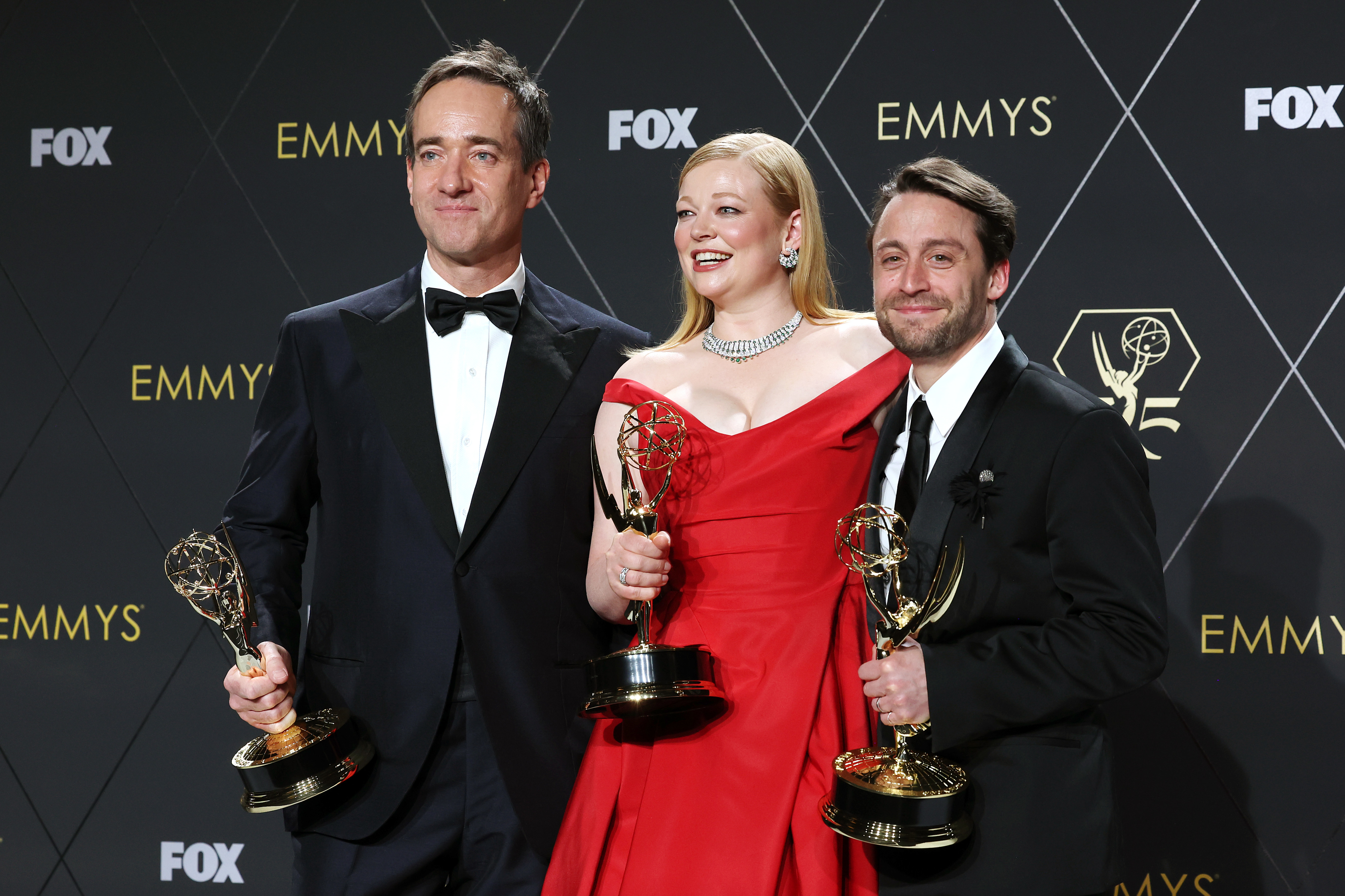 Matthew McaFadyen, Sarah Snooks, and Kieran Culkin posing with their individual Emmys