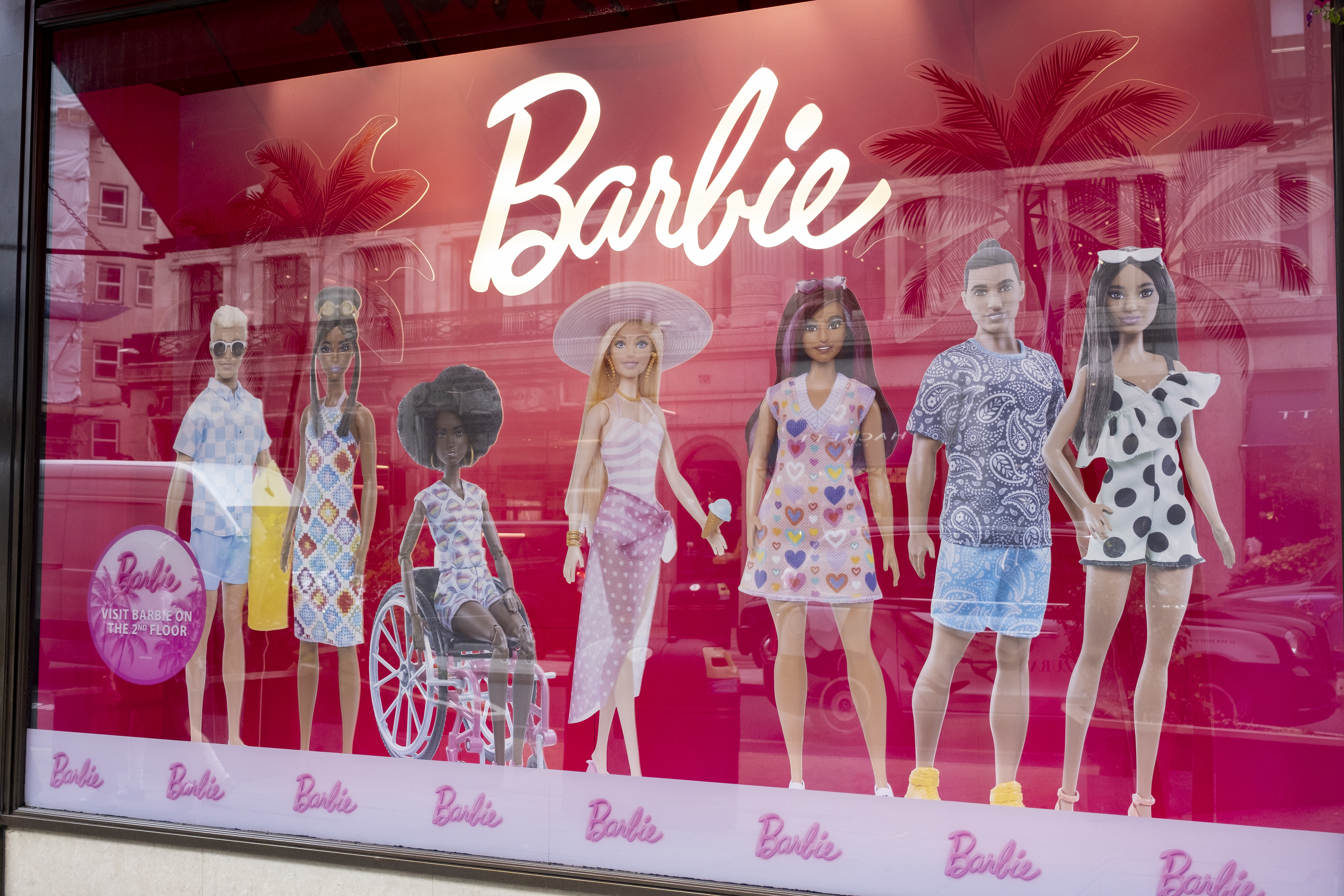 barbie billboard with different barbies and kens