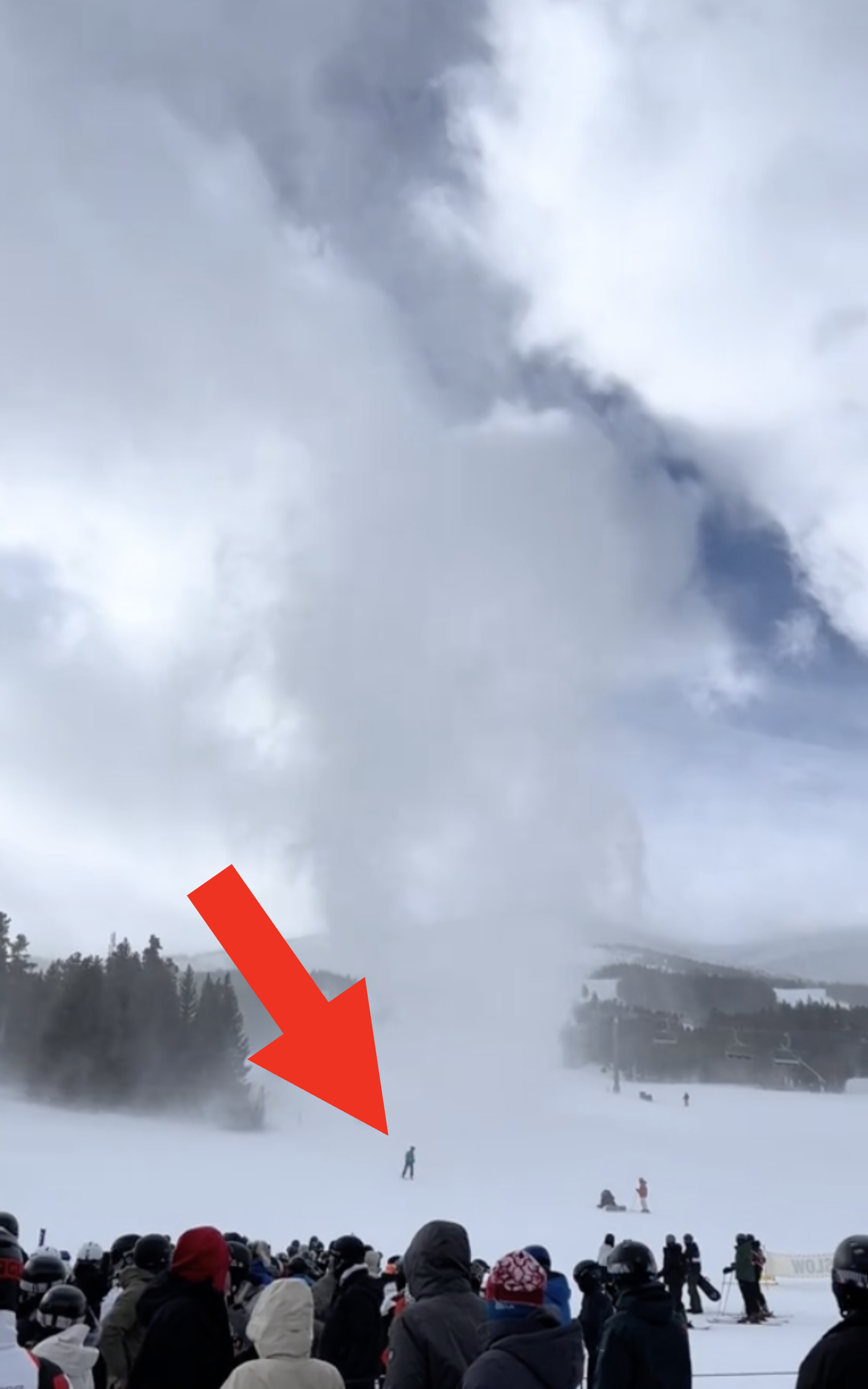 Arrow pointing to a small human figure at the bottom of the &quot;snownado&quot;